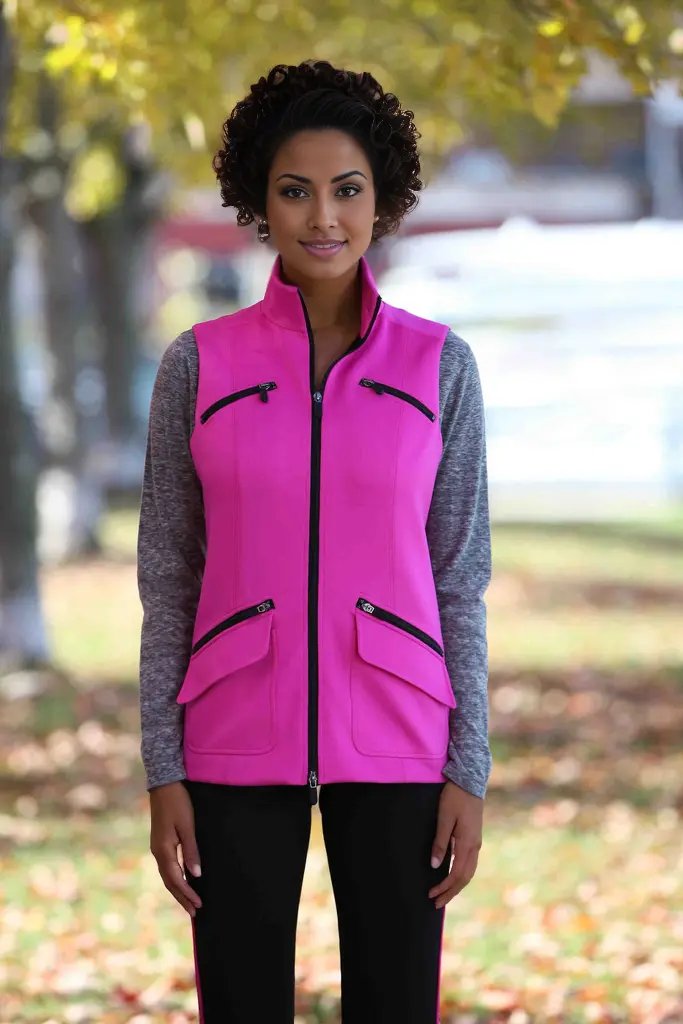 Marolli Pink Vest. This sleeveless vest is specifically designed to flatter. The special zipper details and collar give it a sporty and feminine look.  The high-quality material is extremely comfortable, breathable, and has moisture wicking properties to help keep you cool and dry. Goes great with many different color tees for that fashionable sporty look.